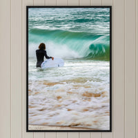 Short Point Surfer in a black frame without a mat, on a panelled hallway wall
