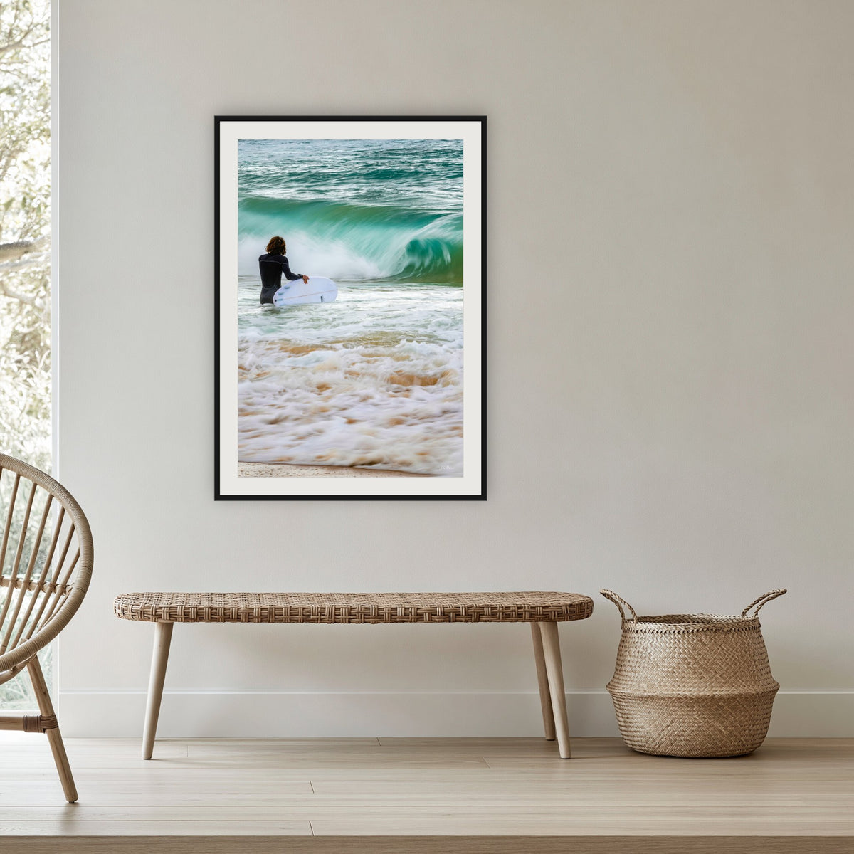 Short Point Surfer framed print in black with a white mat, in a cane-panelled hallway