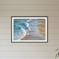 Tura Beach Waves framed print in black with a white mat, on a coastal lounge room wall