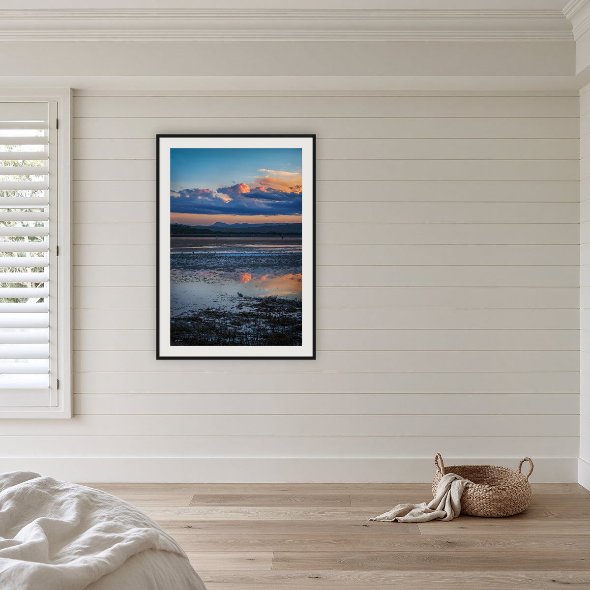 Bird on Boardwalk framed print in black with a white mat, in a coastal bedroom