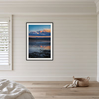 Bird on Boardwalk framed print in black with a white mat, in a coastal bedroom