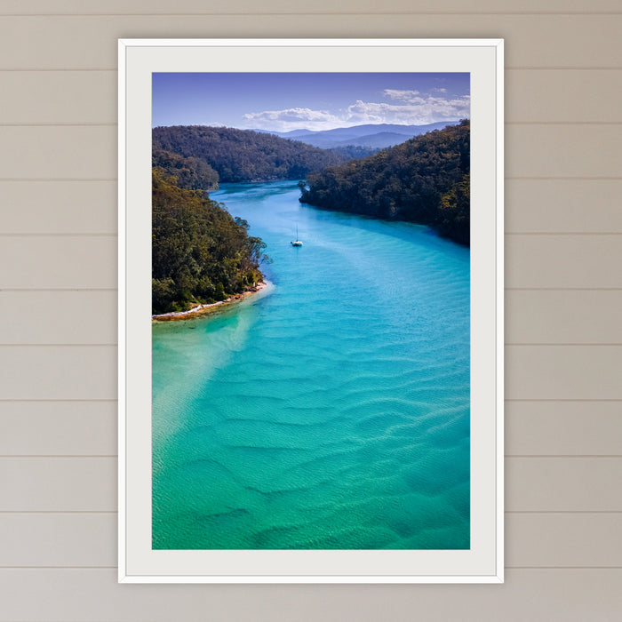 Pambula River Safe Shelter framed print in white with a mat, in a coastal lounge room