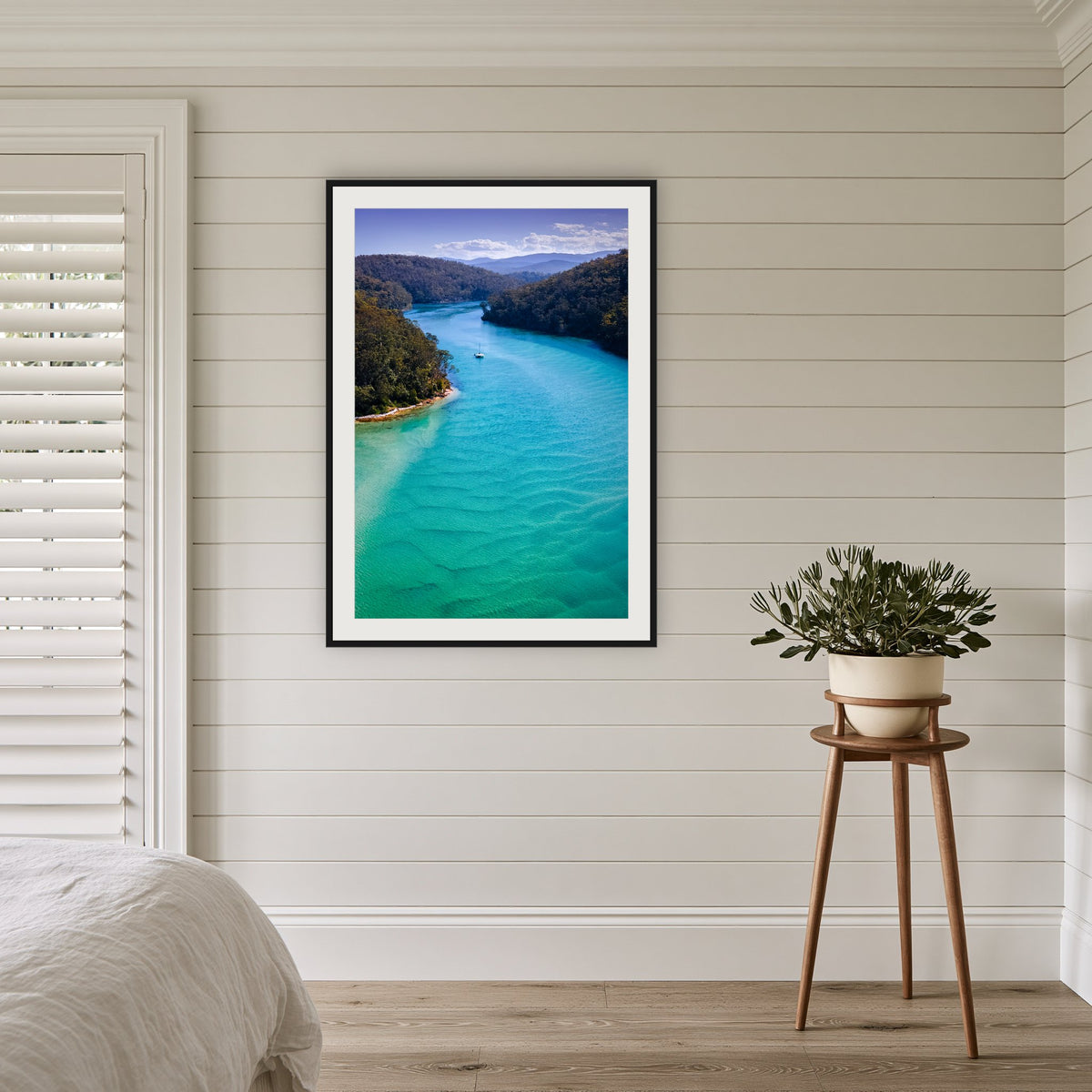 Pambula River Safe Shelter framed print in black with a white mat, in a coastal bedroom