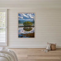 Merimbula Boardwalk Vista in an oak frame without a mat, above the bed in a white coastal bedroom