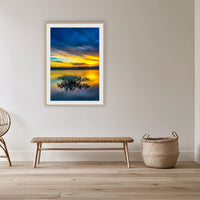 Mangrove Reflections framed print in oak with a white mat, in a cane-panelled hallway