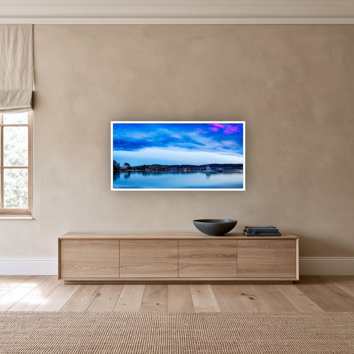 Dawn Delight wide panorama of Merimbula Lake in a white frame above a long oak sideboard — wall art, Sapphire Coast NSW