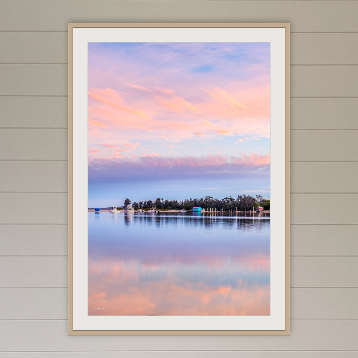 Pastel Pink Paradise framed print in oak with a white mat, in a coastal lounge room