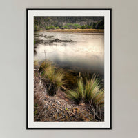 Yowaka River framed print in black with a white mat, in a cane-panelled hallway