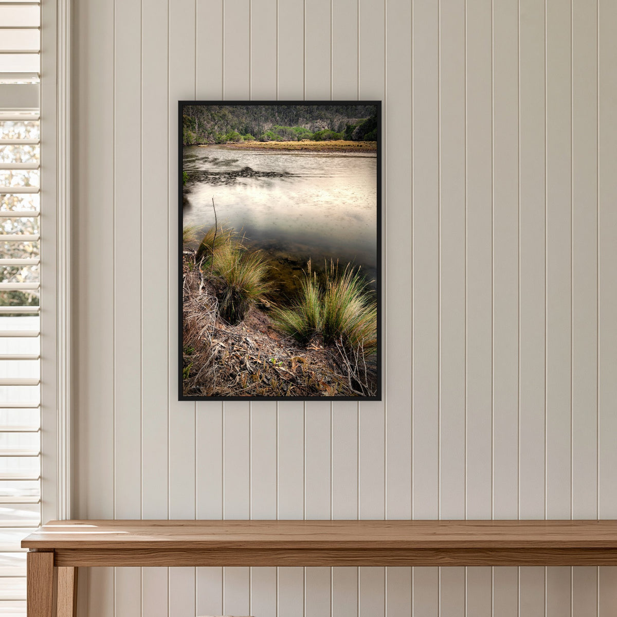 Yowaka River in a black frame without a mat, on a panelled hallway wall