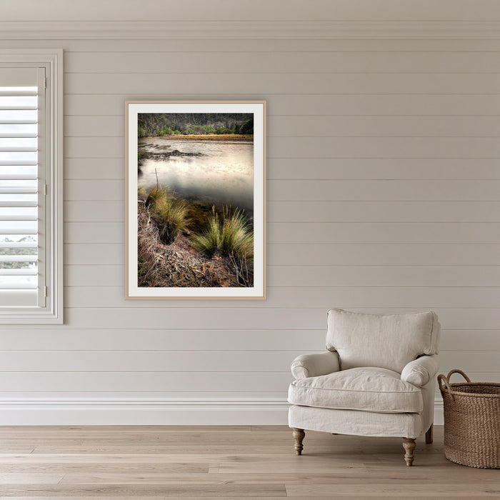 Yowaka River framed print in oak with a white mat, on a coastal lounge room wall