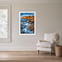 Tathra Rocks framed print in white with a mat, in a coastal lounge room