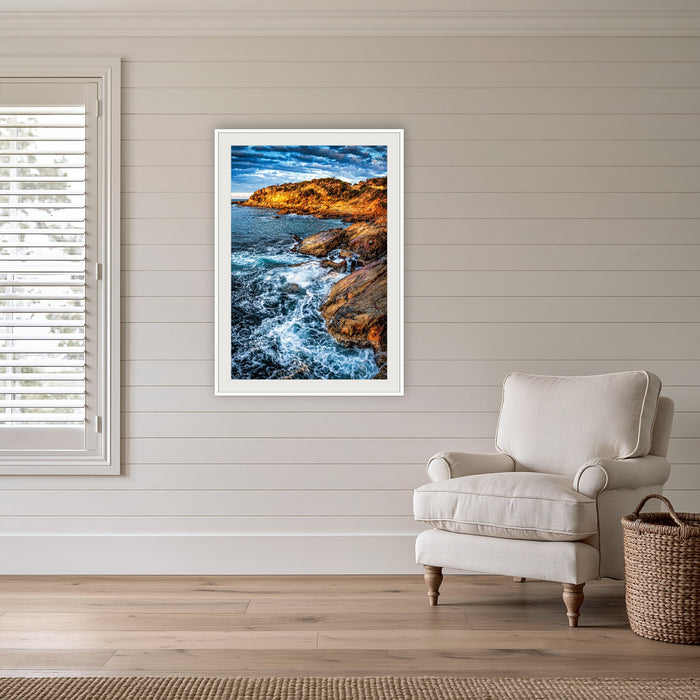 Tathra Rocks framed print in white with a mat, in a coastal lounge room