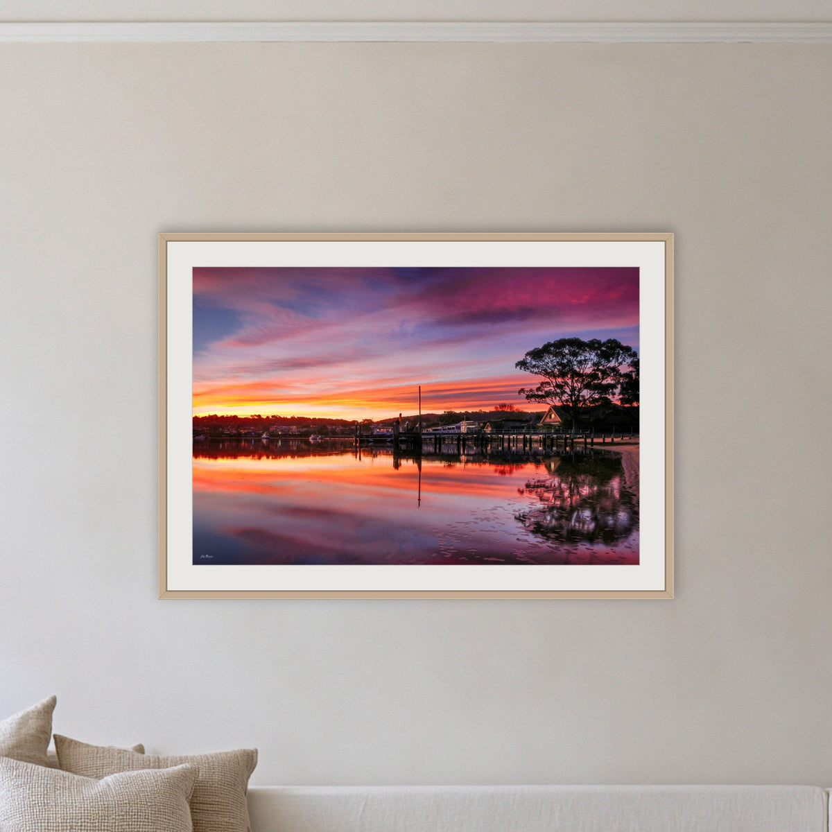 Spencer Park framed print in oak with a white mat, on a coastal lounge room wall