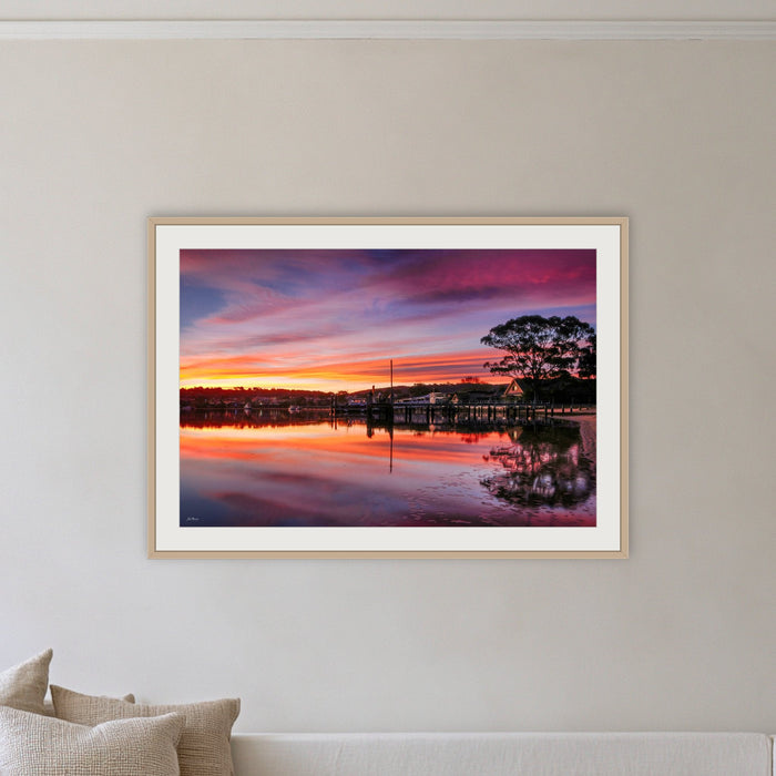 Spencer Park framed print in oak with a white mat, on a coastal lounge room wall