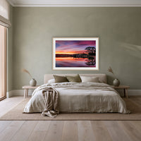 Spencer Park framed print in oak with a white mat, above a linen bed against a sage wall in a bedroom