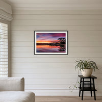 Spencer Park framed print in black with a white mat, above a sofa