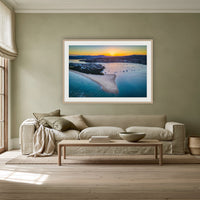 Fishpen Aerial View framed print in oak with a white mat, above a linen sofa against a sage wall in a lounge room