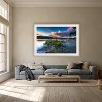 Merimbula through a Mangrove Tree framed print in oak with a white mat, above a dusty blue linen sofa in a lounge room