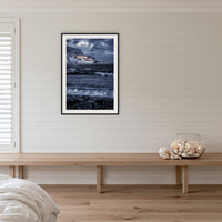 Merimbula Wharf B&W with Colour framed print in black with a white mat, on a coastal bedroom wall