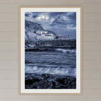 Merimbula Wharf framed print in oak with a white mat, on a coastal lounge room wall