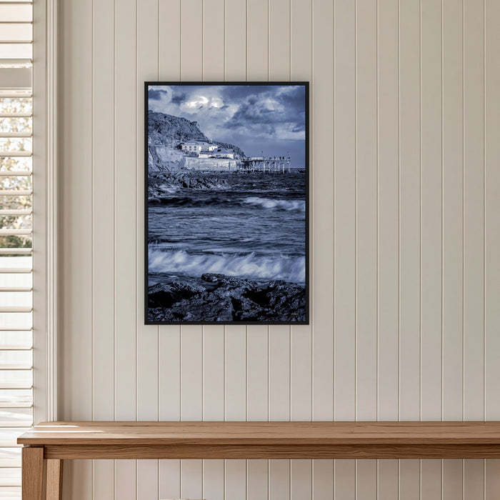 Merimbula Wharf in a black frame without a mat, on a panelled hallway wall