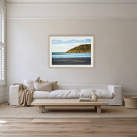 Pambula River Sea Entrance framed print in oak with a white mat, on a coastal lounge room wall