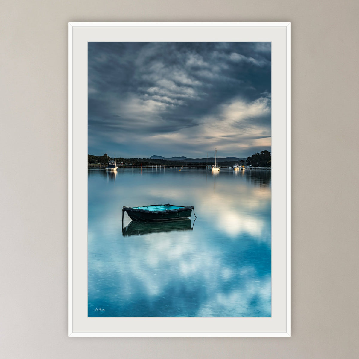 Little Boat framed print in white with a mat, in a cane-panelled hallway