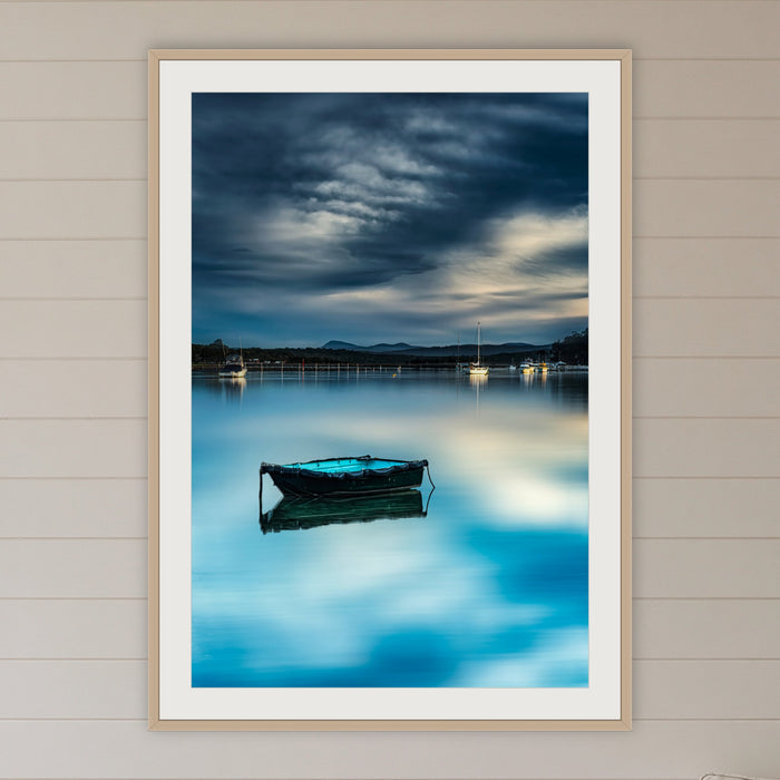 Little Boat Artistic Treatment framed print in oak with a white mat, in a coastal lounge room