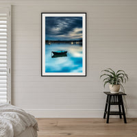 Little Boat Artistic Treatment framed print in black with a white mat, on a coastal bedroom wall