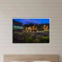 Wheelers Restaurant in a white frame without a mat, in a bedroom