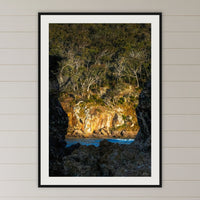 Pambula Beach Rock Frame framed print in black with a white mat, in a coastal bedroom