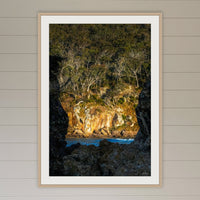 Pambula Beach Rock Frame framed print in oak with a white mat, in a coastal lounge room