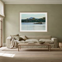 Twofold Bay, Eden framed print in oak with a white mat, above a linen sofa against a sage wall in a lounge room