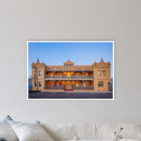 Hotel Australasia in a white frame without a mat, in a coastal lounge room