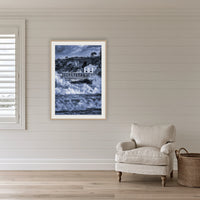 Tathra Wharf and Waves in black and white, framed print in oak with a white mat, on a coastal lounge room wall