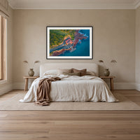 Merimbula Wharf framed print in black with a white mat, above an ivory linen bed in a bedroom