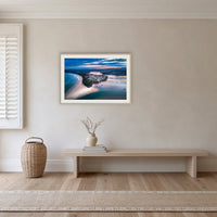 Fishpen on Dusk framed print in oak with a white mat, in a hallway