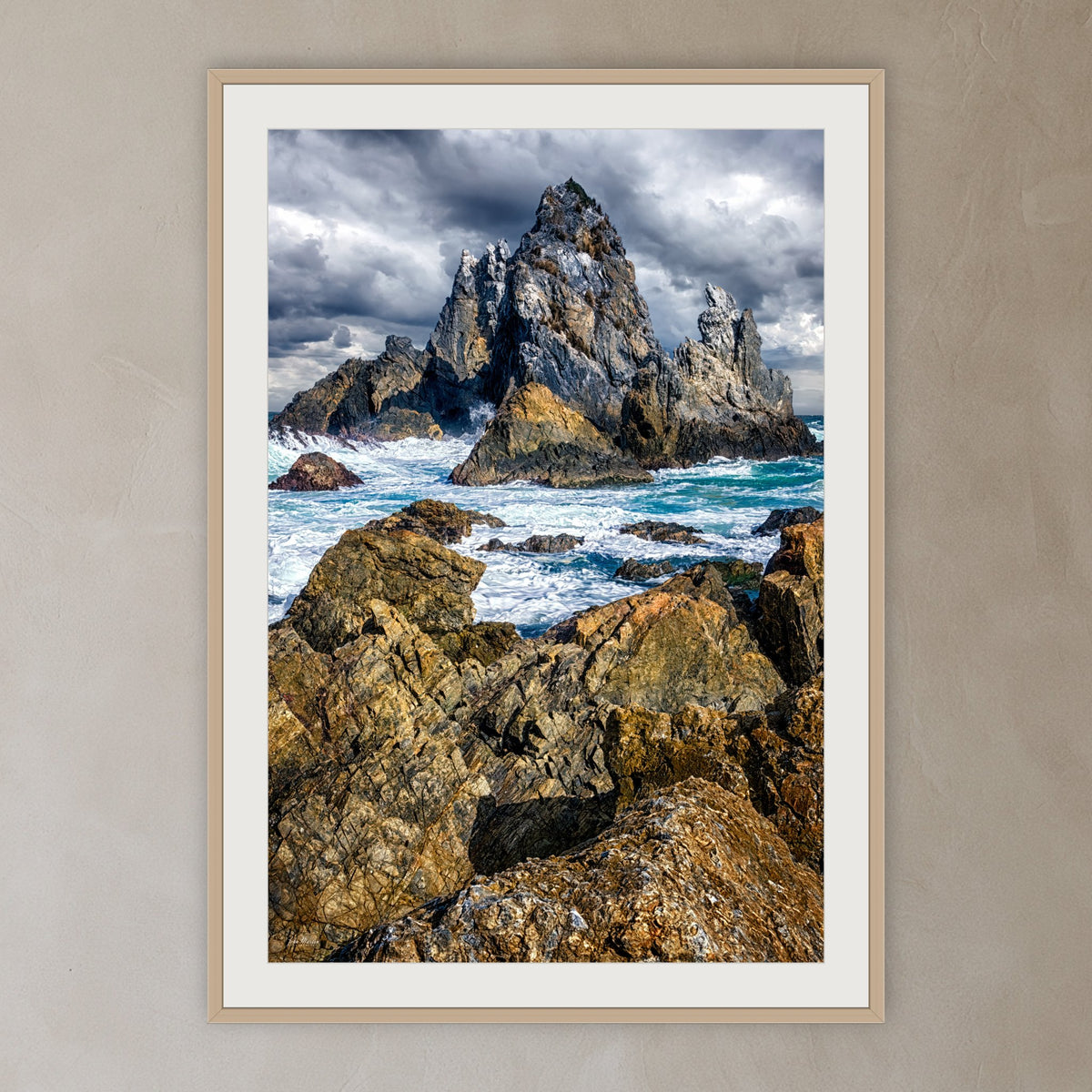 Camel Rock framed print in oak with a white mat, in a plaster-walled hallway