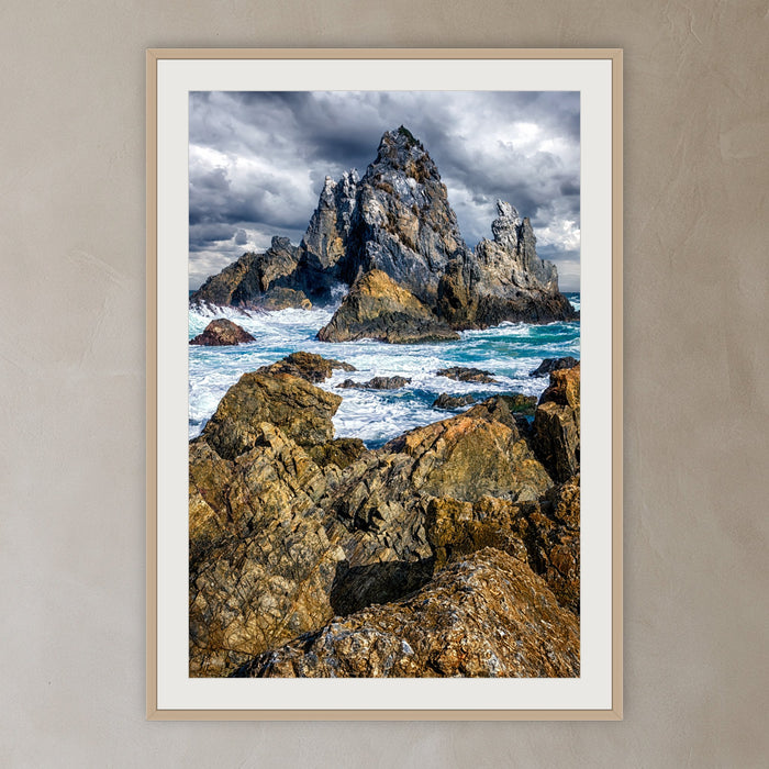 Camel Rock framed print in oak with a white mat, in a plaster-walled hallway