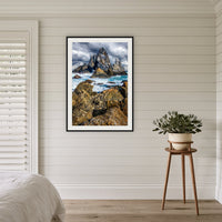 Camel Rock framed print in black with a white mat, in a coastal bedroom