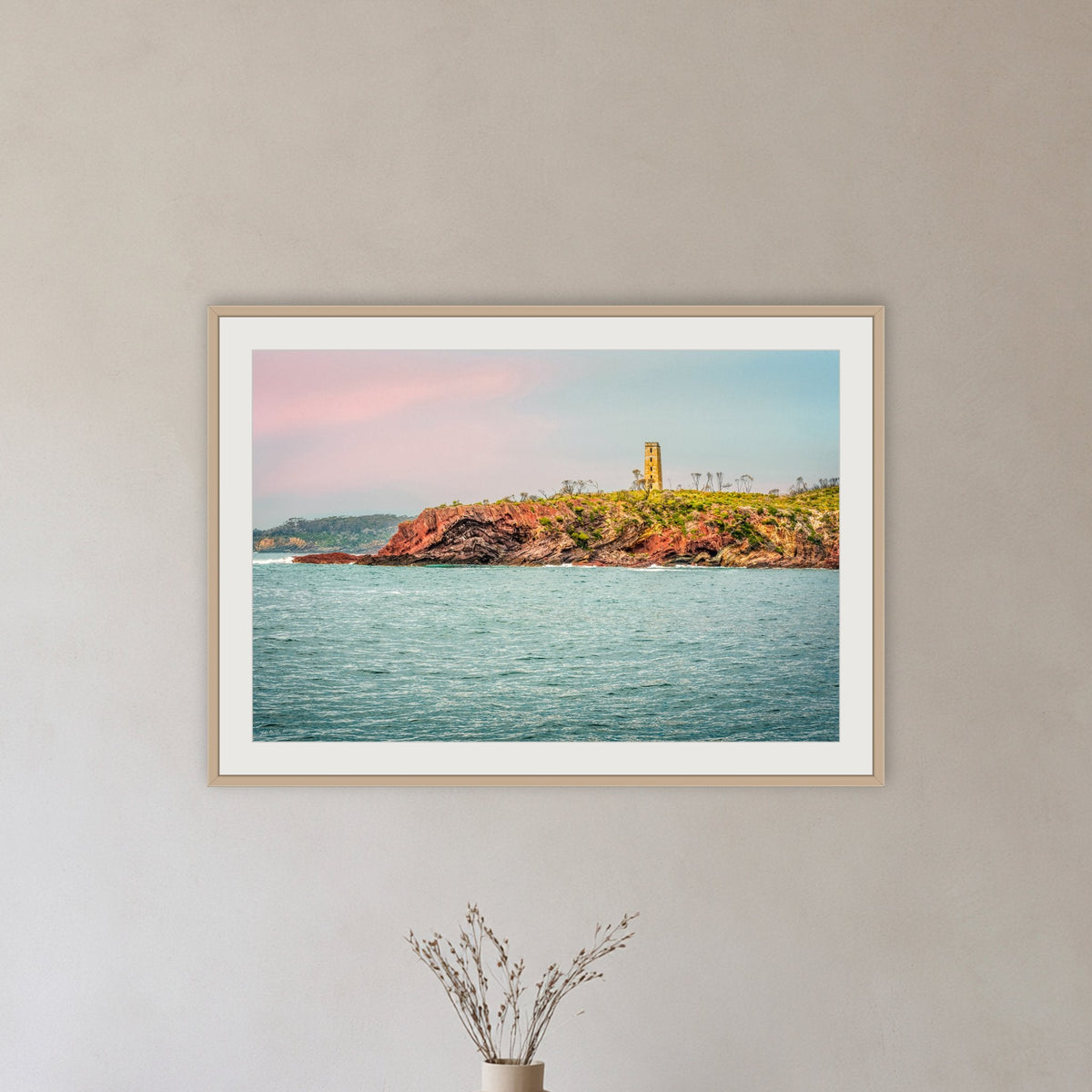 Ben Boyd Tower Seascape framed print in oak with a white mat, in a hallway