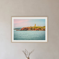 Ben Boyd Tower Seascape framed print in oak with a white mat, in a hallway