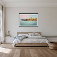 Ben Boyd Tower Seascape framed print in black with a white mat, in a bedroom