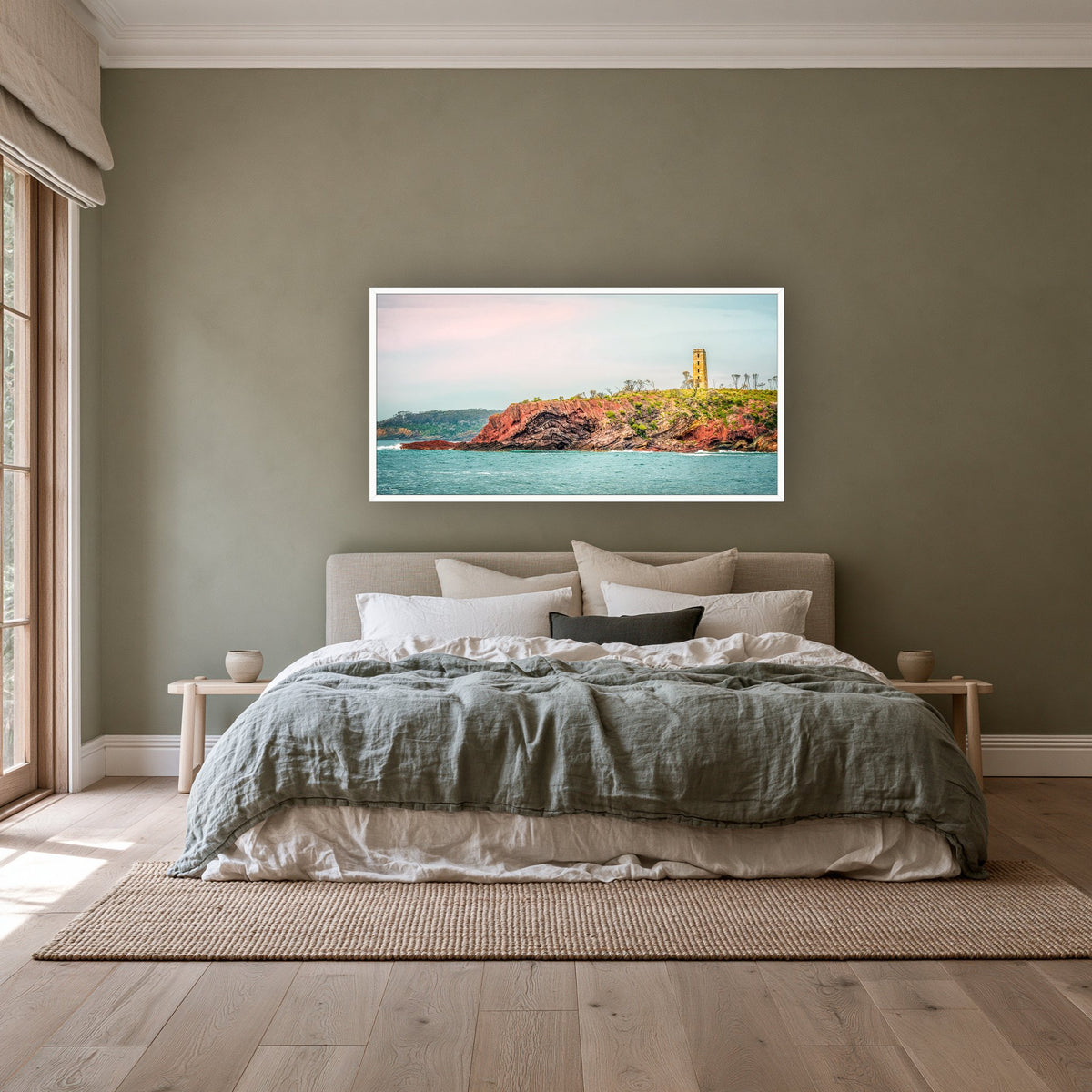 Ben Boyd Tower from the Sea wide panorama in a white frame above a linen bed on a sage wall — wall art, Eden NSW