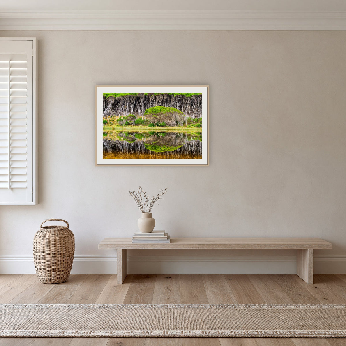 Bournda Lagoon Reflections framed print in oak with a white mat, in a hallway