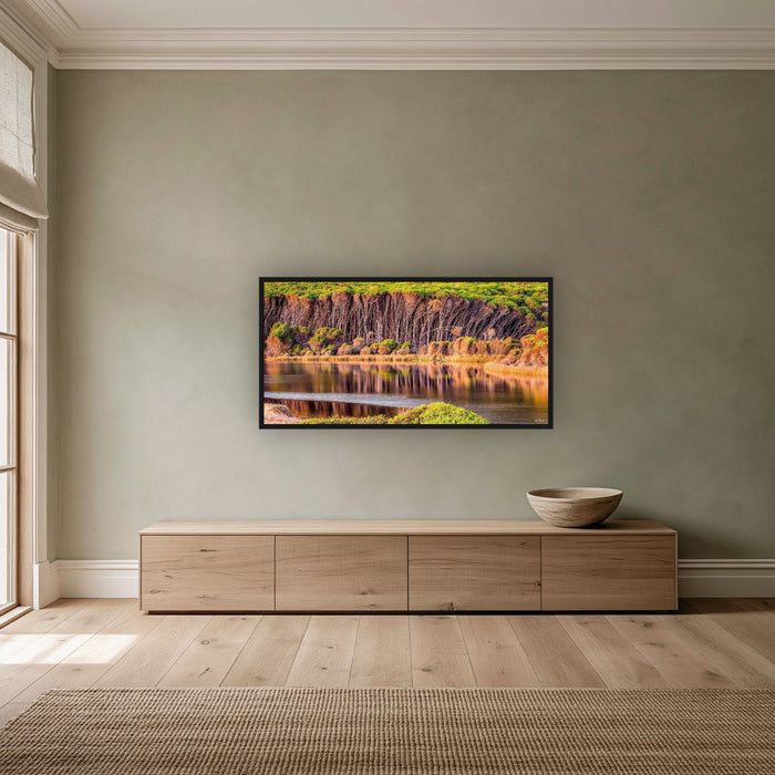 Bournda Lagoon wide panorama in a black frame above a long oak sideboard on a sage wall — wall art, Sapphire Coast NSW