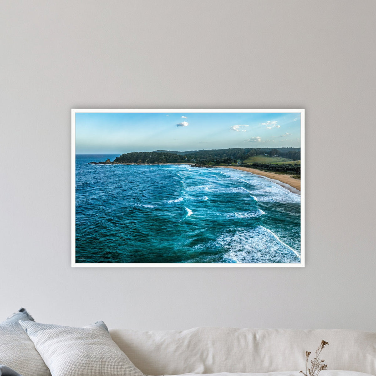 Cuttagee Beach in a white frame without a mat, on a lounge room wall