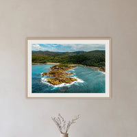 Mimosa Rocks framed print in oak with a white mat, in a hallway