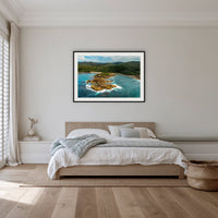 Mimosa Rocks framed print in black with a white mat, in a bedroom