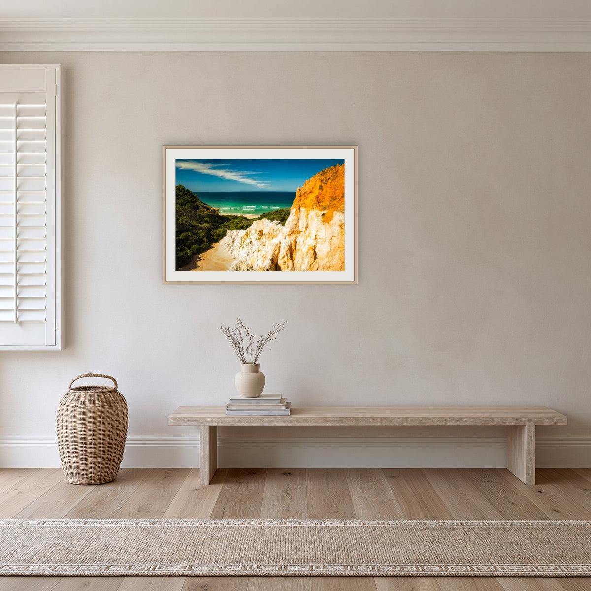The Pinnacles framed print in oak with a white mat, in a hallway